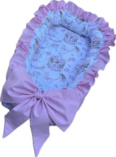 Beautiful pink frilly carousel baby nest