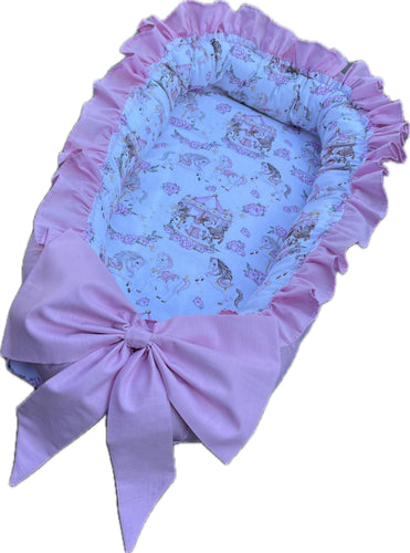 Beautiful pink frilly carousel baby nest