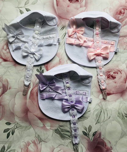 Frilly bib and dummy clip sets