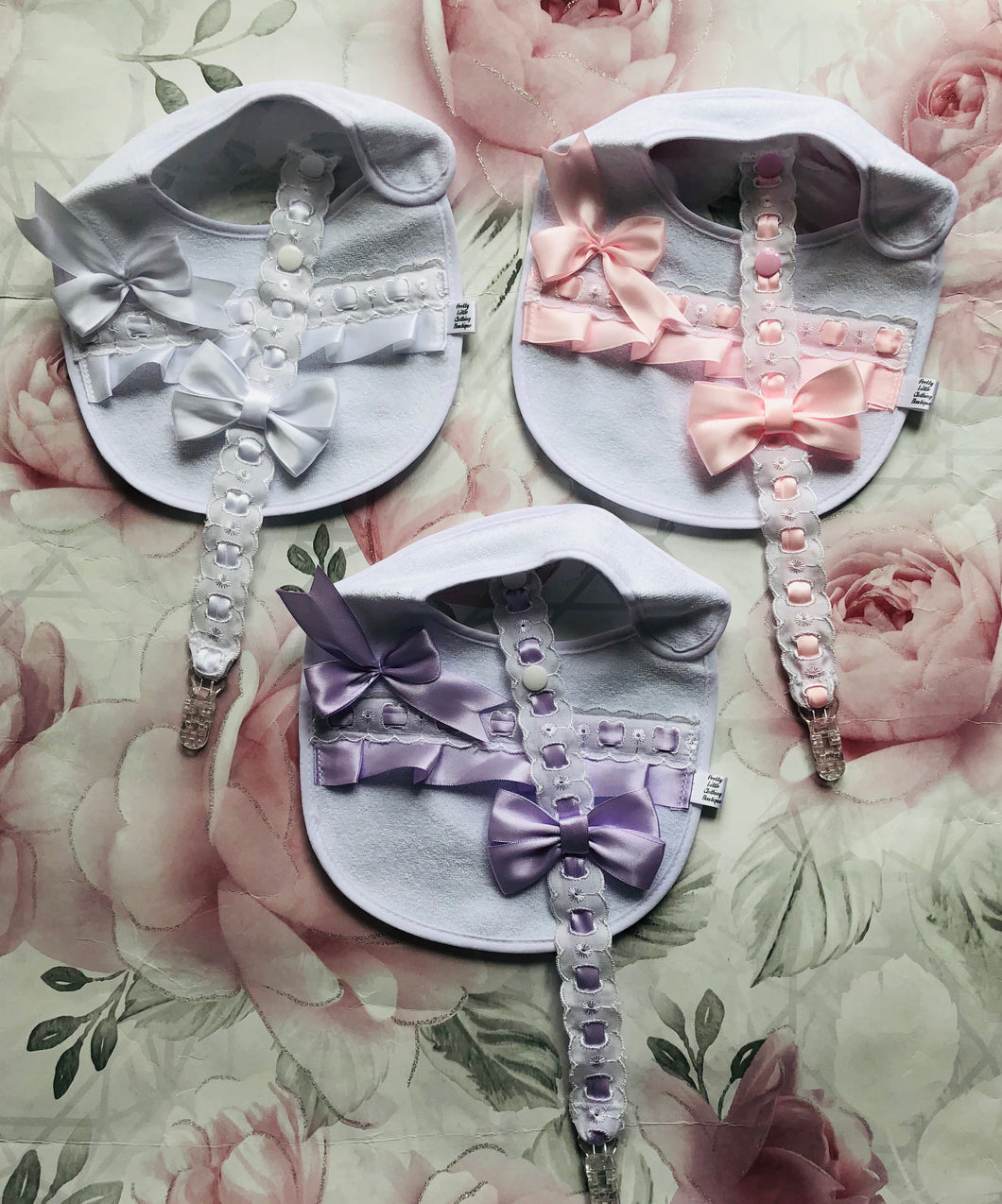 Frilly bib and dummy clip sets